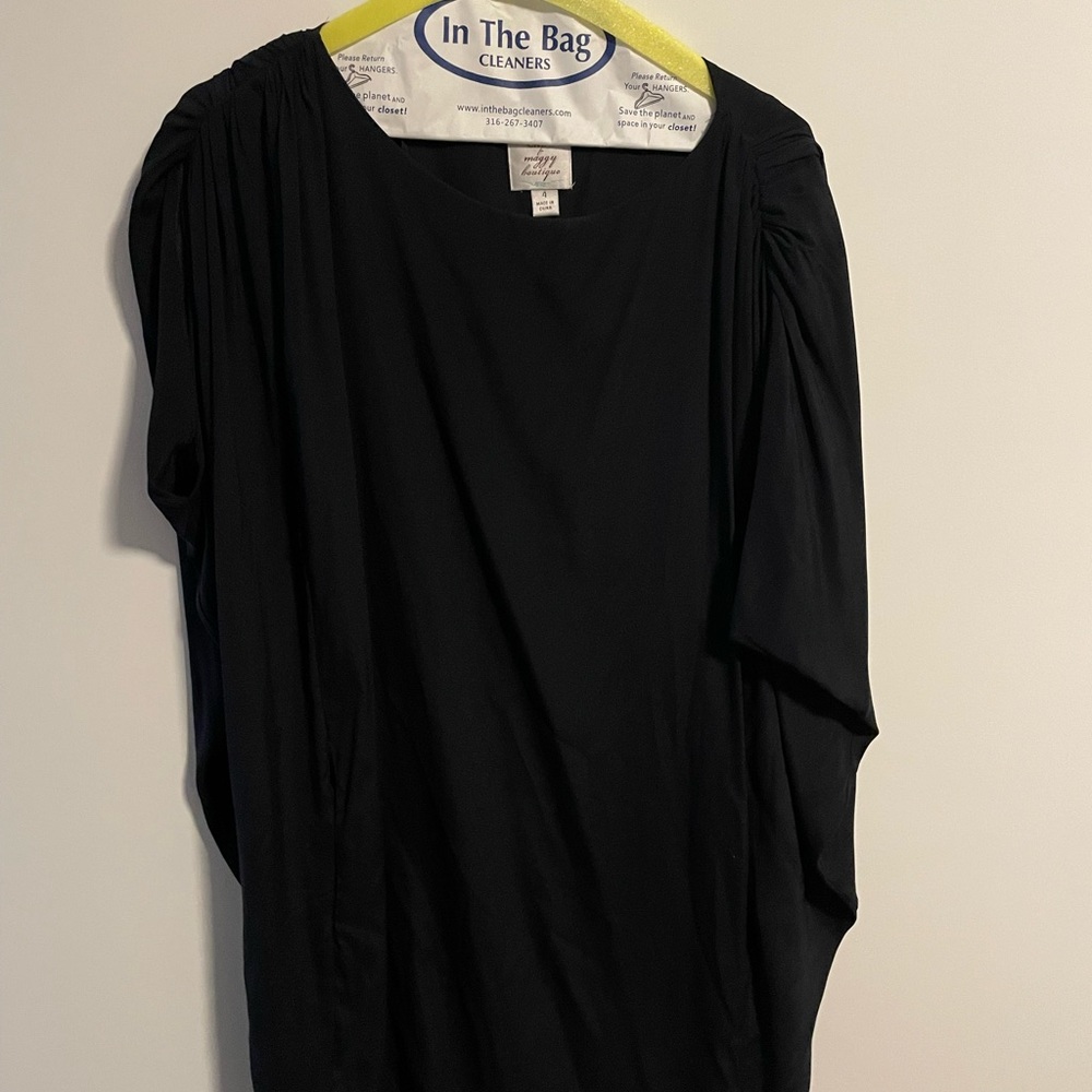 Black sleeveless dress with shoulder details